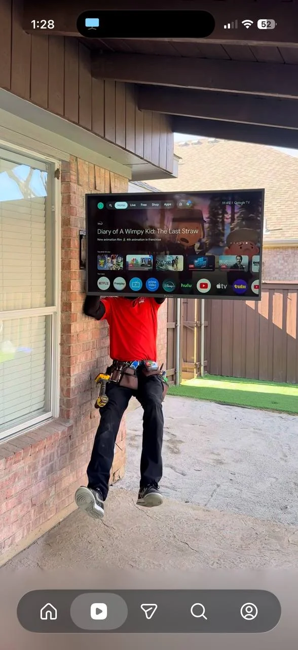 55-inch TV mounted on exterior brick wall under covered patio in Los Angeles